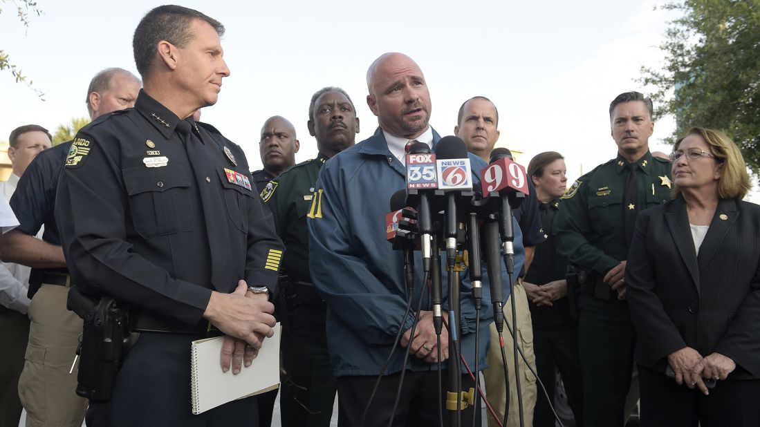 Ron Hopper of the FBI answers questions from members of the media on June 12. Listening are Orlando Police Chief John Mina, left, and Orange County Mayor Teresa Jacobs. 