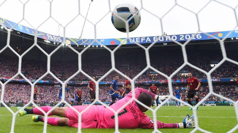 Turkish goalkeeper Volkan Babacan is unable to save Modric's long-range effort.