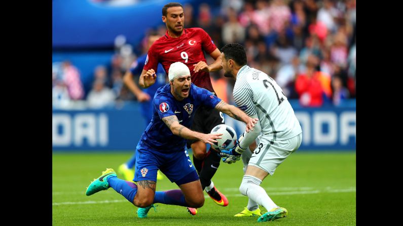 Corluka controls the ball under pressure.