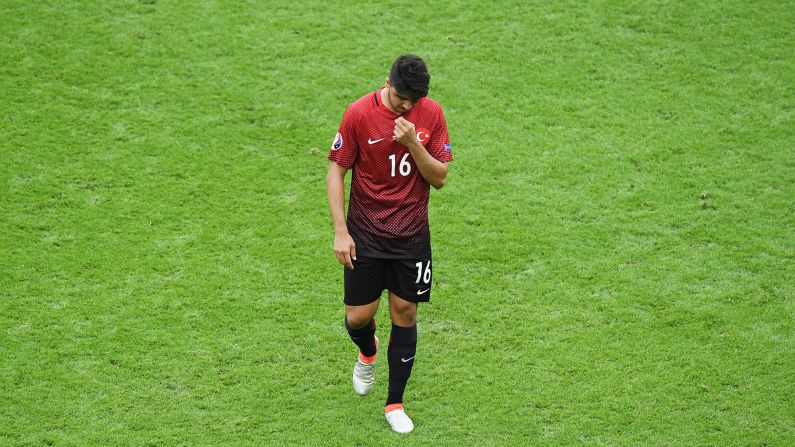 Turkey's Ozan Tufan leaves the pitch after enduring a frustrating afternoon.