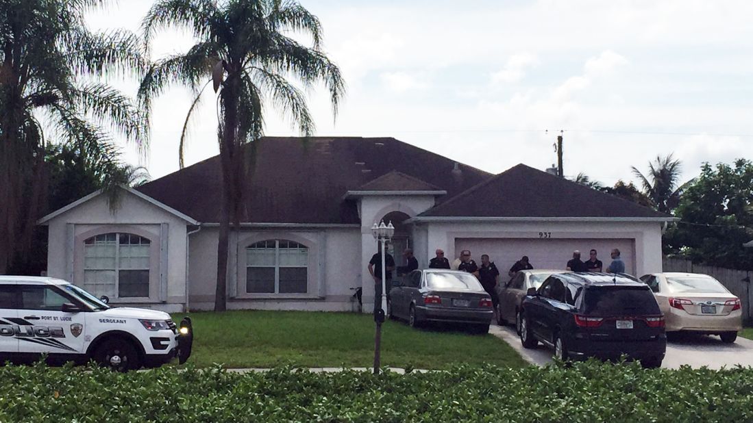 Police gather outside the home in Port St. Lucie, Florida, where Mateen's father lives.