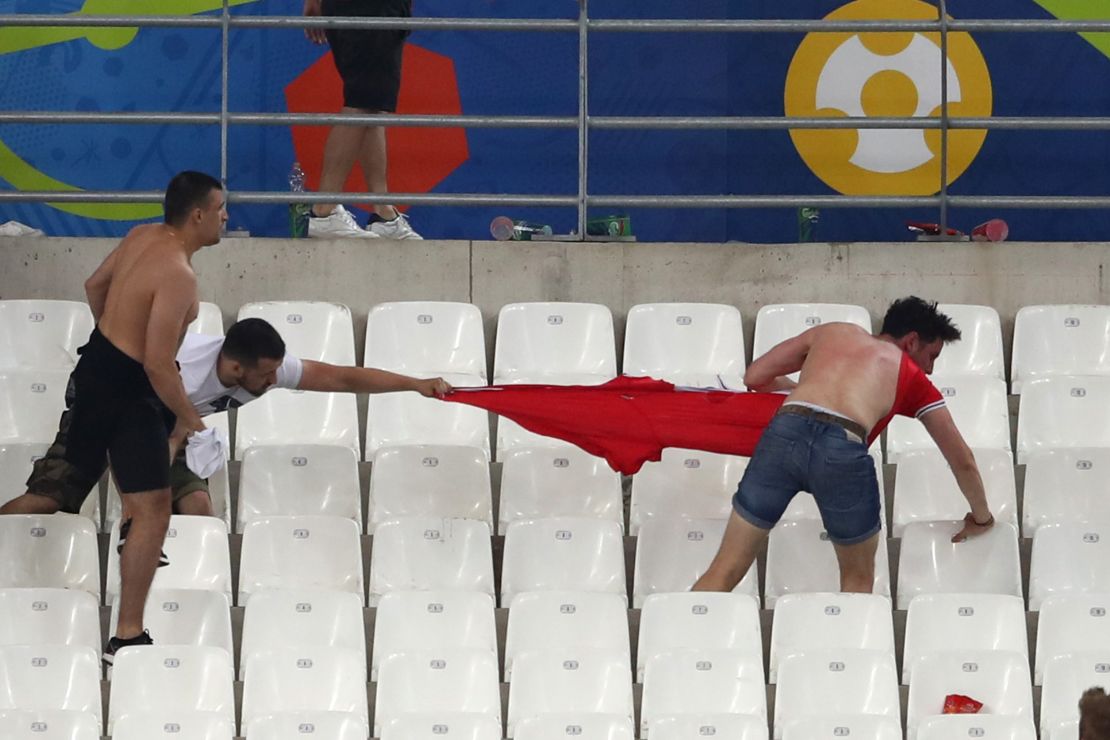 Fans clash at Stade Velodrome in Marseille.