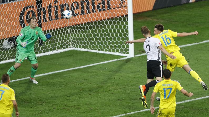 Germany's Shkodran Mustafi heads in the opening goal against Ukraine during a Euro 2016 match in Lille, France, on Sunday, June 12. Bastian Schweinsteiger added a late goal to cap off a 2-0 victory.