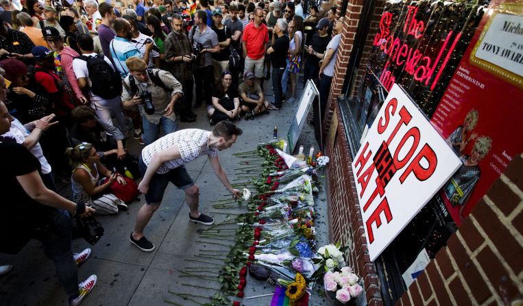 People gather for a vigil June 12 outside the Stonewall Inn in New York. <a href="index.php?page=&url=http%3A%2F%2Fwww.cnn.com%2F2016%2F05%2F09%2Ftravel%2Fstonewall-inn-nps-national-monument-gay-rights%2Findex.html" target="_blank">Stonewall</a> is considered the birthplace of the gay rights movement.