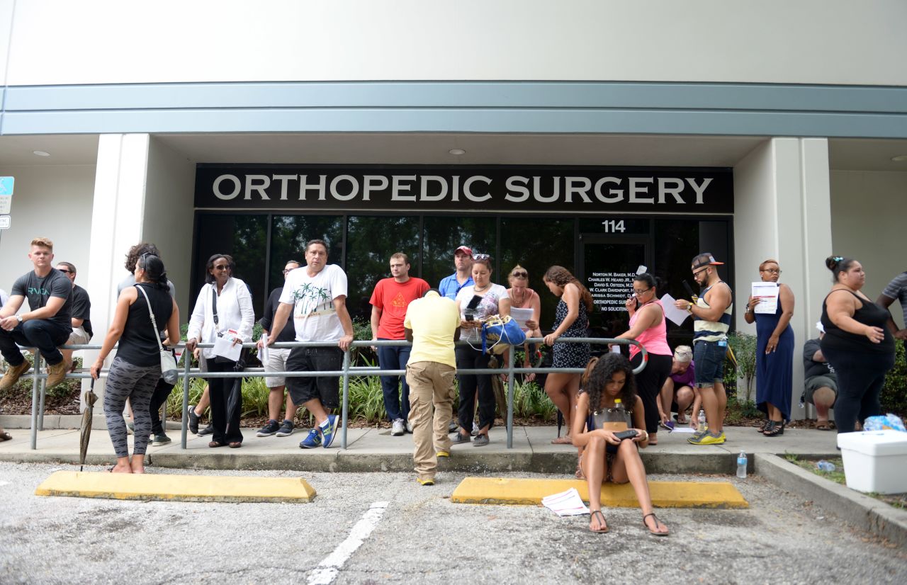 People line up to donate blood at a blood bank in Orlando.