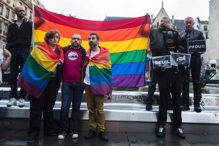 People gather for a vigil near the Beaubourg art center in Paris on June 12. 