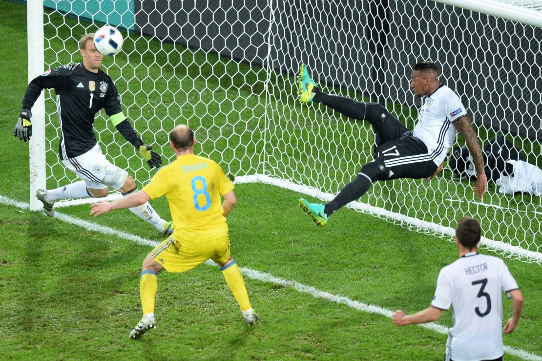 Germany's defender Jerome Boateng clears the ball from his goal.