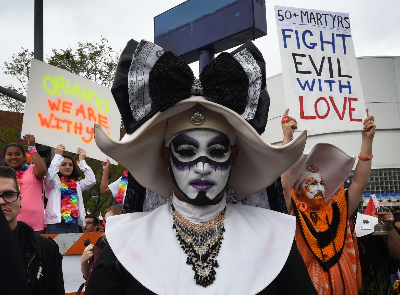 Participants in the Los Angeles gay pride parade show their support for the victims on June 12.