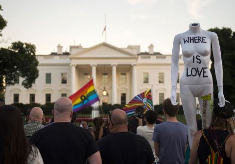 Mourners gather during a vigil in front of the White House on June 12. President Barack Obama called the mass shooting an "act of terror" in remarks to the nation.