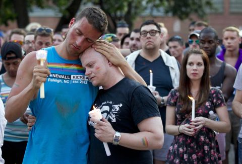 Ryan Gibson, left, embraces Tabor Winstead during a vigil in Raleigh, North Carolina, on June 12.