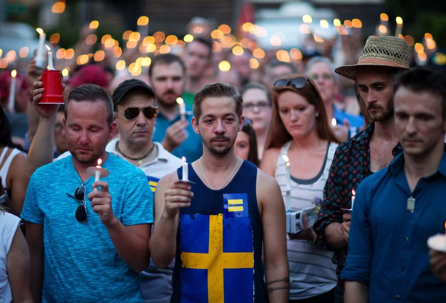 Mourners observe a moment of silence during a vigil in Atlanta.