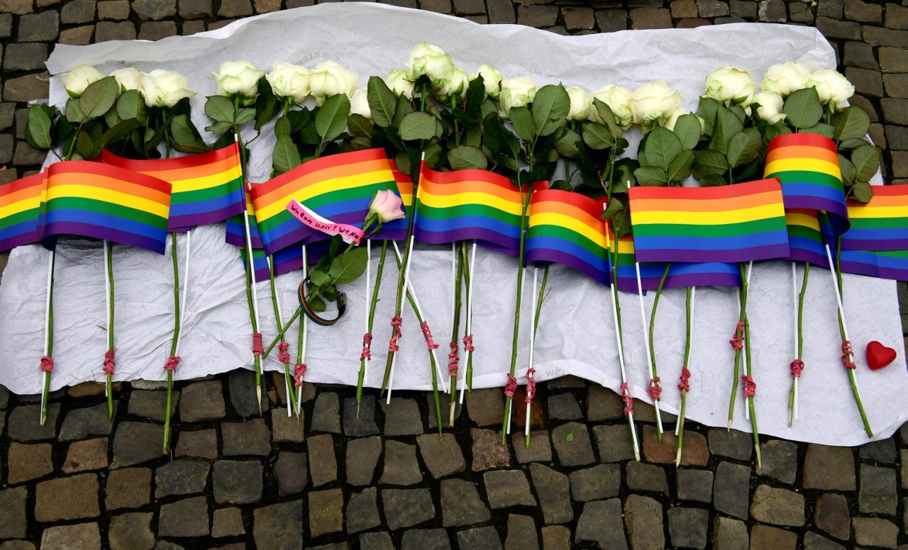 White roses and rainbow flags are displayed in front of the U.S. Embassy in Berlin on June 13.