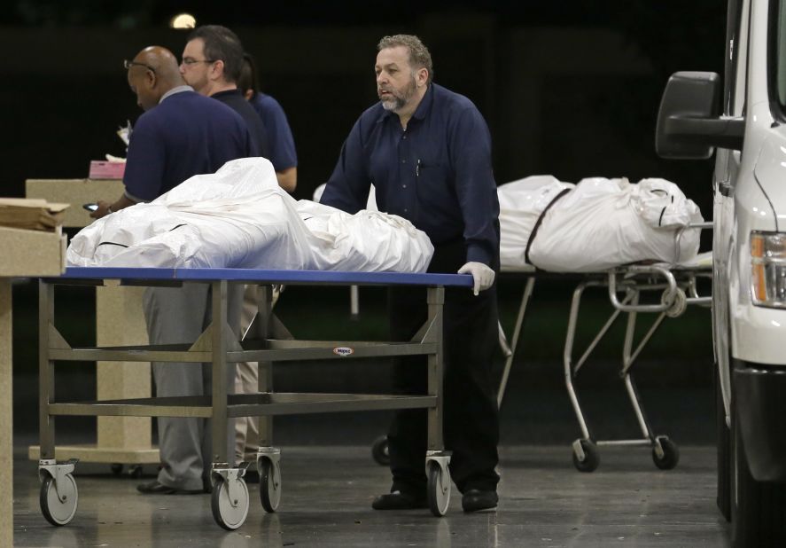 Bodies arrive at the medical examiner's office on June 12.