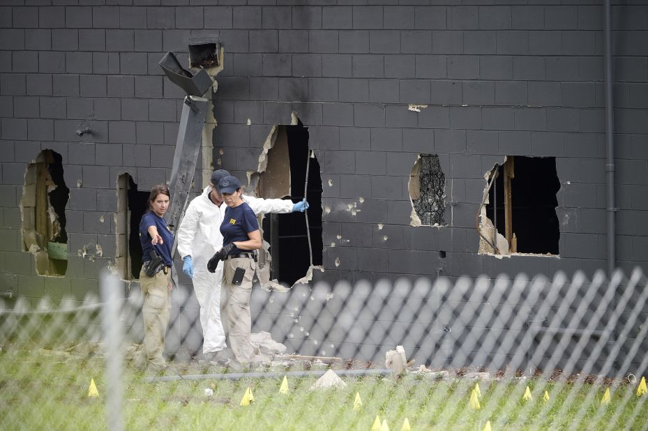 Police investigate the back of the Pulse nightclub in Orlando on Sunday, June 12. At least 49 people were killed there by Omar Mateen, who was shot and killed by Orlando police. It was the deadliest mass shooting in U.S. history.