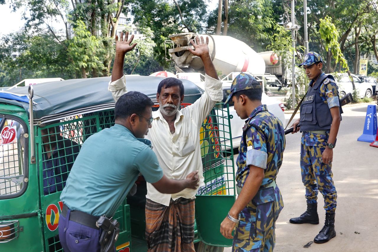 A man is frisked at a police check-post in Gulshan, Dhaka on June 10. 