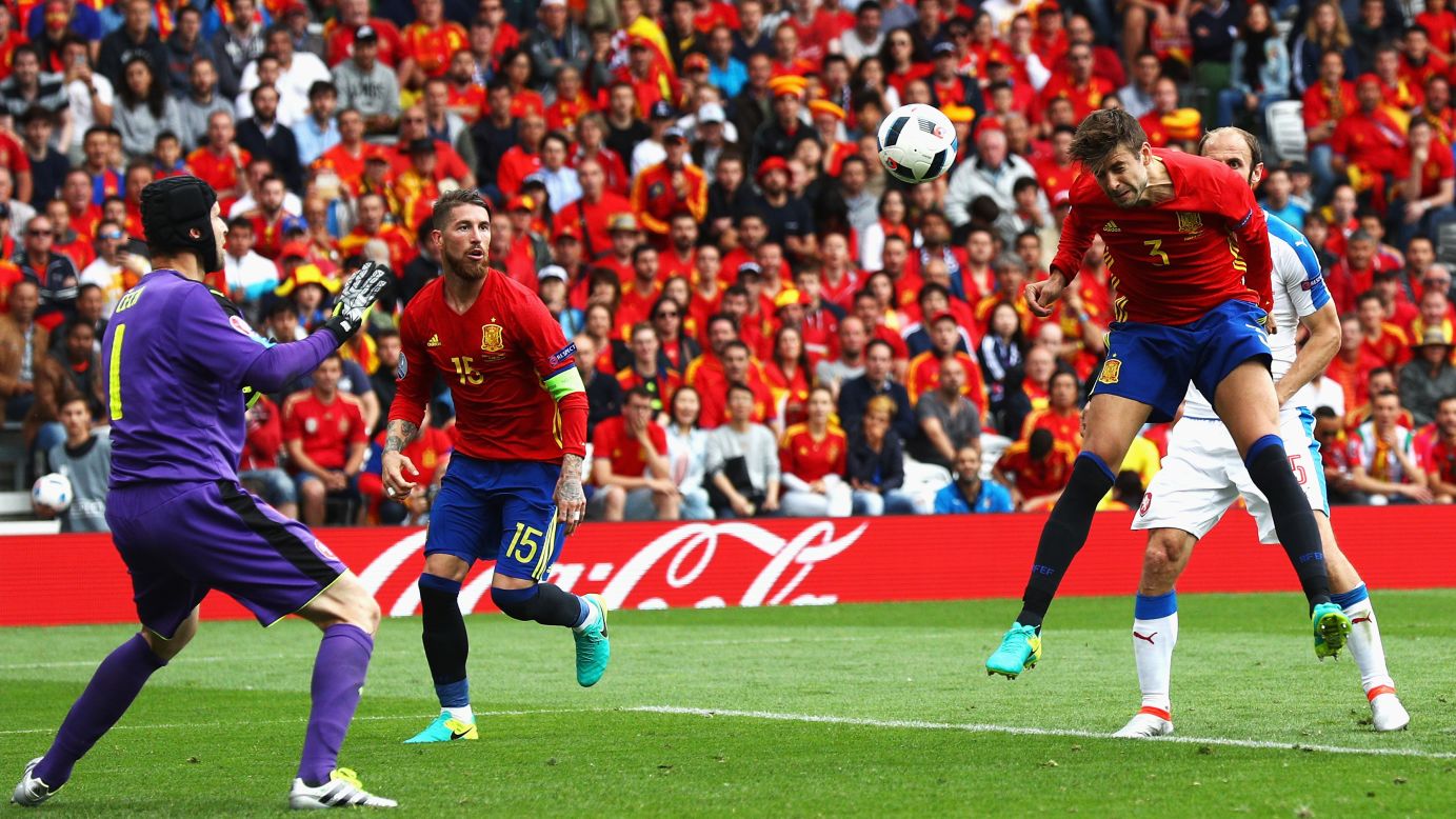 Spanish defender Gerard Pique heads the ball past Czech goalkeeper Petr Cech for the only goal of their Euro 2016 opener. Spain has won the last two Euro tournaments.