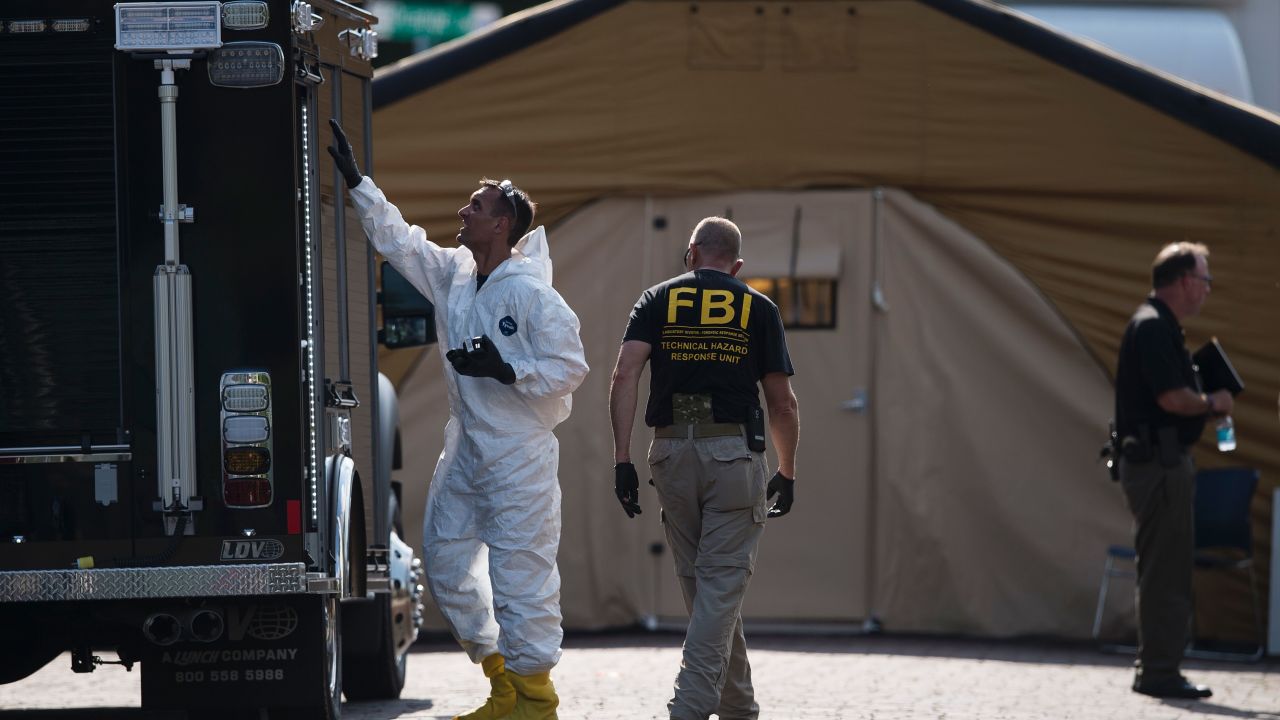 Members of the FBI and other investigators work in the area around the Pulse nightclub June 13, 2016 in Orlando, Florida.
Forty-nine people died and more than 50 were injured early June 12 when a heavily-armed gunman opened fire and seized hostages at a gay nightclub in Orlando, Florida, in the worst mass shooting in US history. / AFP / Brendan Smialowski        (Photo credit should read BRENDAN SMIALOWSKI/AFP/Getty Images)