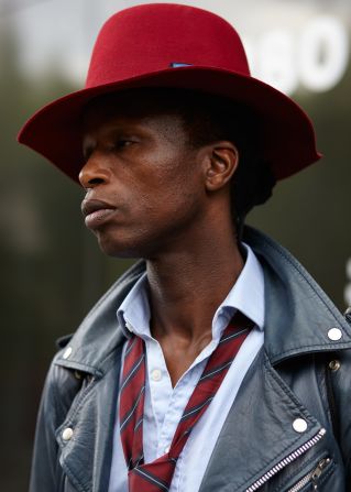 Zokaya Kamara, a fashion blogger, wears a hat by Crown by Christies before Lou Dalton's collection went on show.