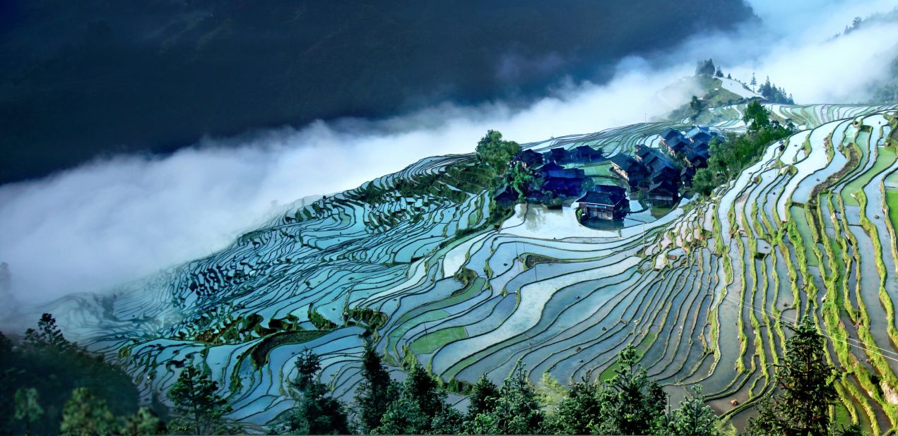 Terraced farming is common in hilly Guizhou.  The Jiabang rice terraces, near Congjiang in the province's southeast corner, look their best during summer rains, which leave the fields shimmering in misted reflections. 