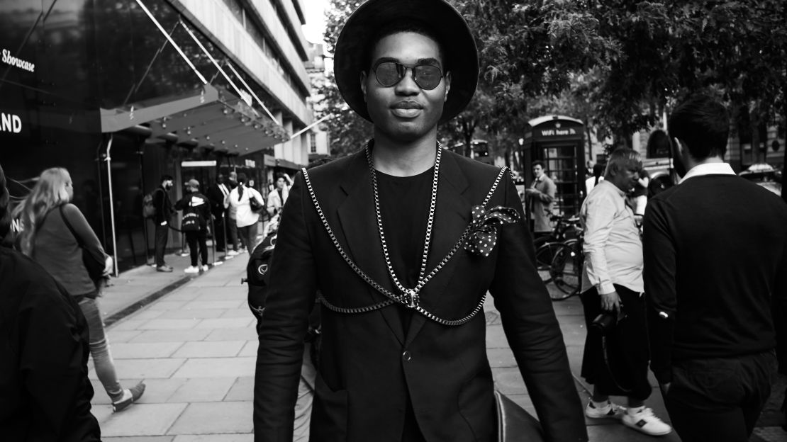 Style blogger Omiri Thomas wears Hugo Boss and Topman outside the central London venue. 