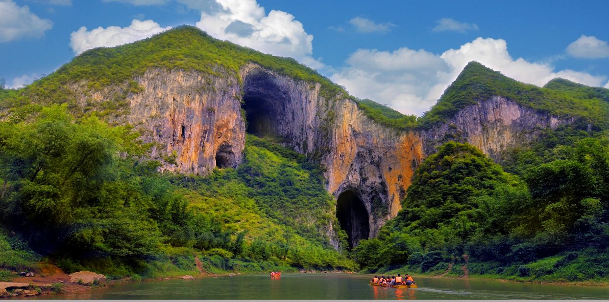 At certain times of year, shards of light shine through the limestone karst arches of the Getu River Scenic Area. The region draws rock climbers from around the world. 