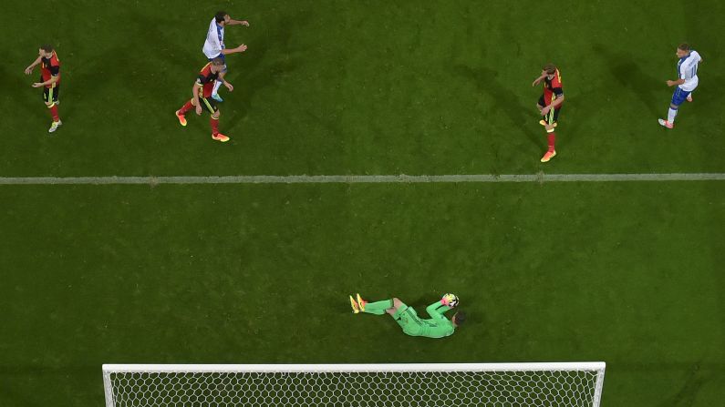 Belgian goalkeeper Thibaut Courtois makes a save.