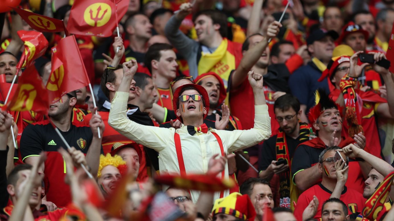 Belgian fans soak up the atmosphere at the stadium in Lyon, France.