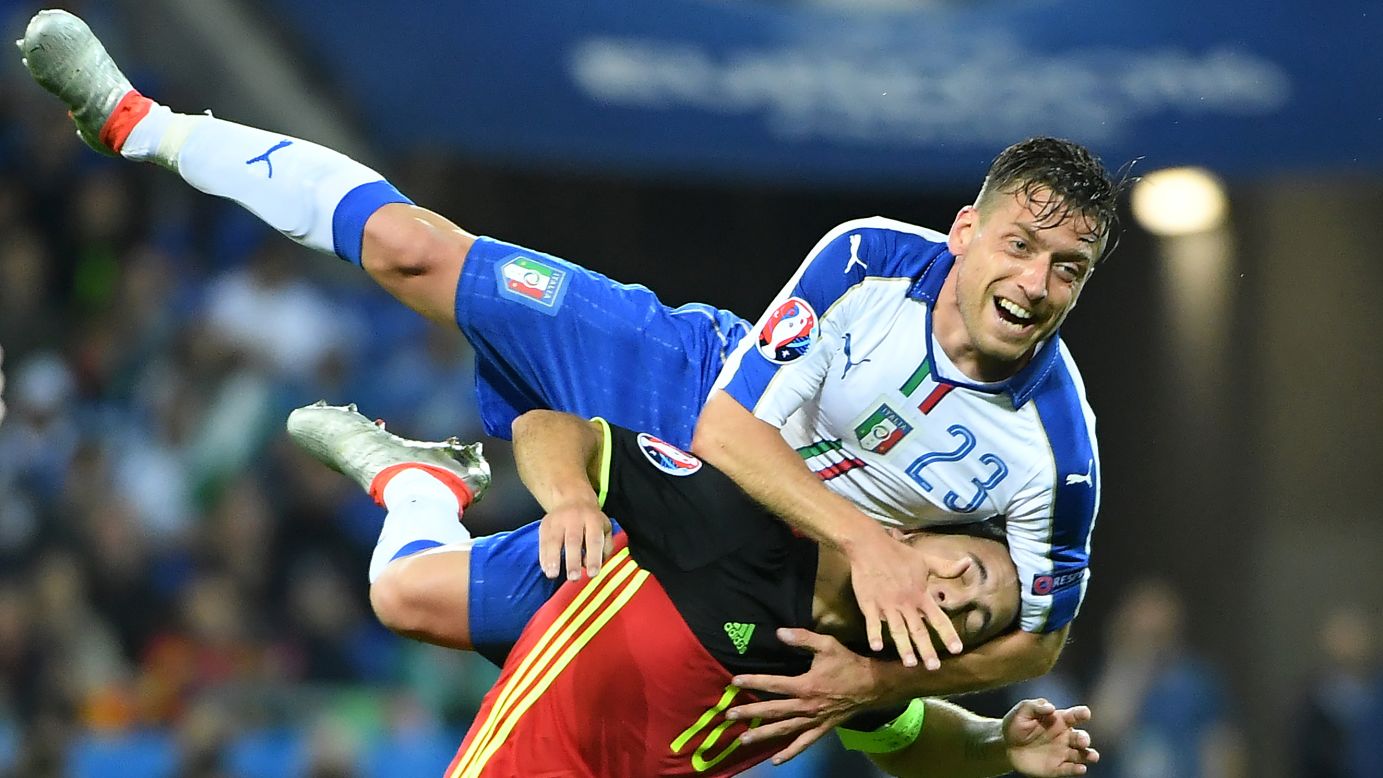 Giaccherini climbs over Belgium captain Eden Hazard.
