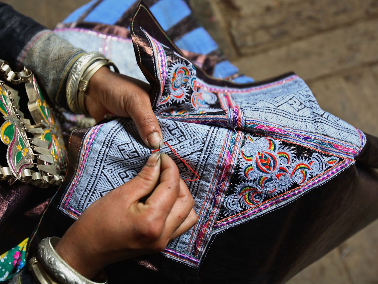 The Miao ethnic minority is famed for its embroidery and some women still weave their own cloth, dyed with homemade indigo paste. 