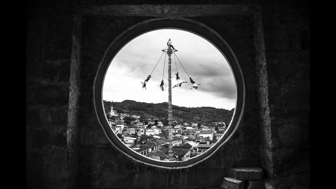 A view of the voladores from a cathedral bell tower in Cuetzalan, Mexico.