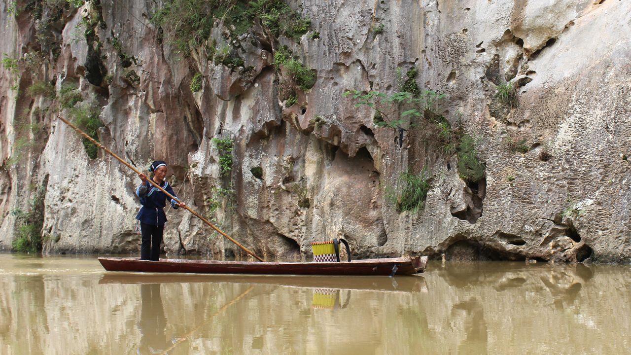 Bamboo rafts are the traditional mode of transport on Guizhou's many rivers. This "sinking stream" in the Getu river scenic area disappears into an eerie karst cave network.