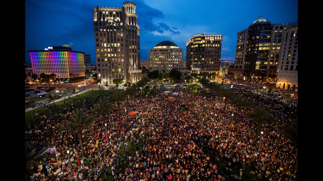 Thousands gather in Orlando on Monday, June 13, to pay tribute to those who were killed the day before.