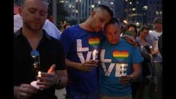 ORLANDO, FL - JUNE 13:  People hold candles during a memorial service at the Dr. Phillips Center for the Performing Arts for the victims of the Pulse gay nightclub shooting where Omar Mateen allegedly killed 49 people, June 13, 2016 in Orlando, Florida. At least 49 people were killed and 53 others injured in what is the deadliest mass shooting in the country's history.  (Photo by Joe Raedle/Getty Images)