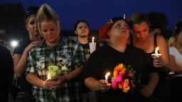 ORLANDO, FL - JUNE 13: Crystal Murphy, Krya Murphy, Nicole Edwards and Kellie Edwards (L-R) stand together during a memorial service at the Dr. Phillips Center for the Performing Arts for the victims of the Pulse gay nightclub shooting where Omar Mateen allegedly killed 49 people, June 13, 2016 in Orlando, Florida. At least 49 people were killed and 53 others injured in what is the deadliest mass shooting in the country's history.  (Photo by Joe Raedle/Getty Images)