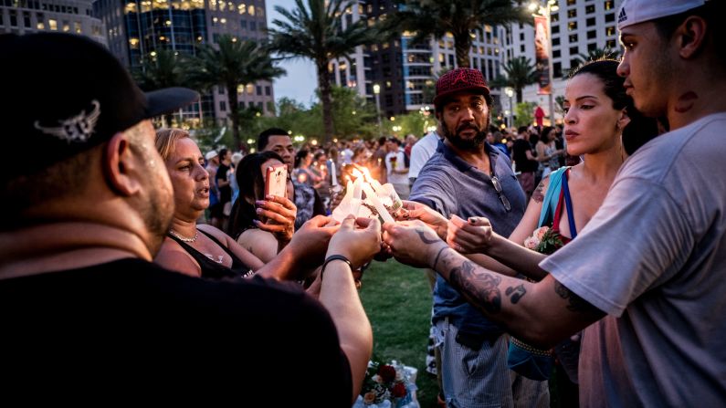 People light candles during a vigil one day after a<a  target="_blank"> gunman killed 49 people</a> at a gay nightclub, marking the <a  target="_blank">deadliest mass shooting in U.S. history</a>.