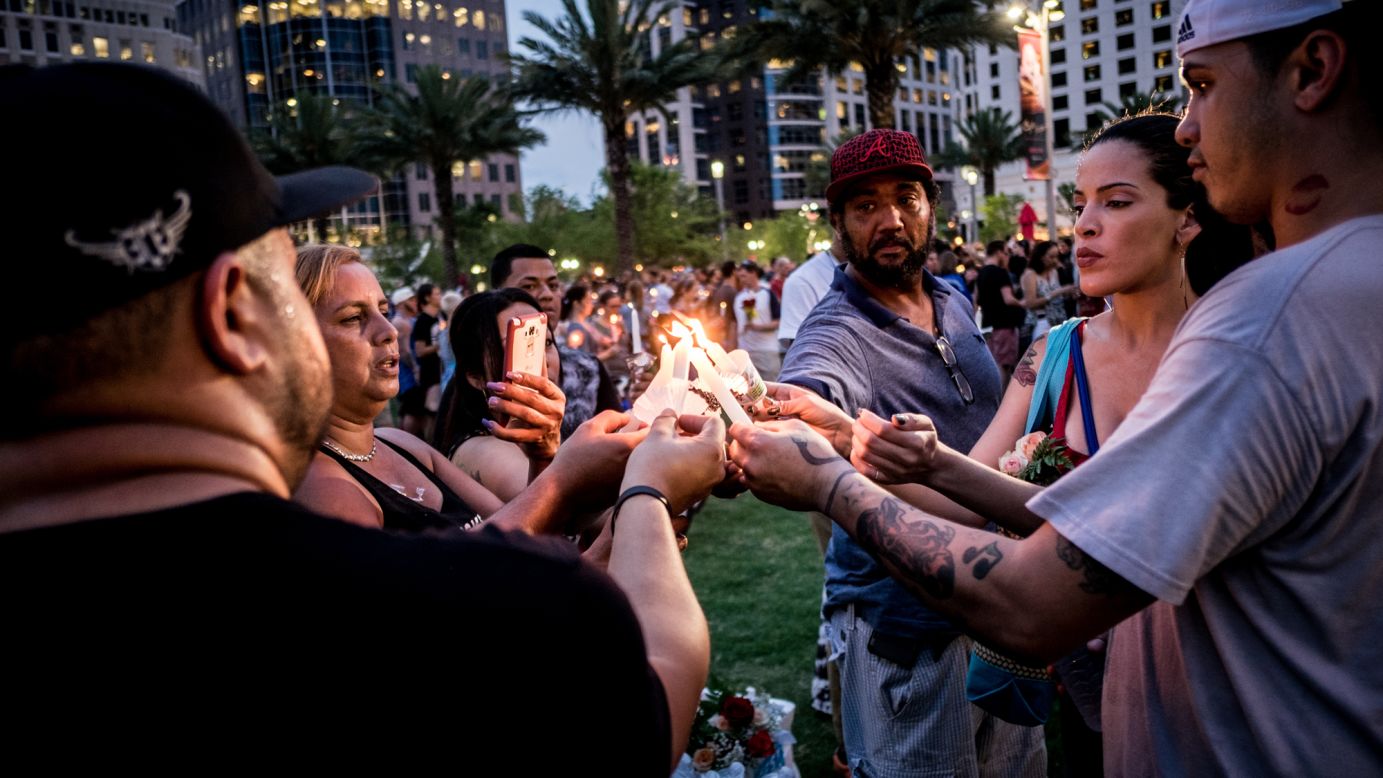 People light candles during a vigil one day after a<a href="http://www.cnn.com/2016/06/12/us/gallery/orlando-shooting/index.html" target="_blank"> gunman killed 49 people</a> at a gay nightclub, marking the <a href="http://www.cnn.com/2013/07/19/us/gallery/worst-shootings-in-us/index.html" target="_blank">deadliest mass shooting in U.S. history</a>.