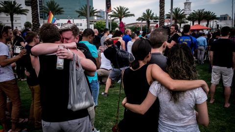 Mourners embrace at the vigil, which took place in front of the Dr. Phillips Center for the Performing Arts in downtown Orlando.