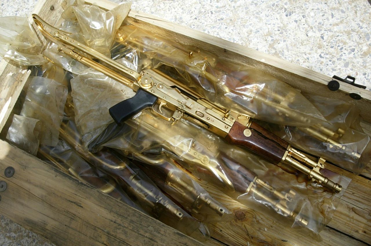 Gold Kalashnikov rifles with the Arabic inscription "A gift from Iraqi President Saddam Hussein" were found in plastic bags in Baghdad, on April 12, 2003.