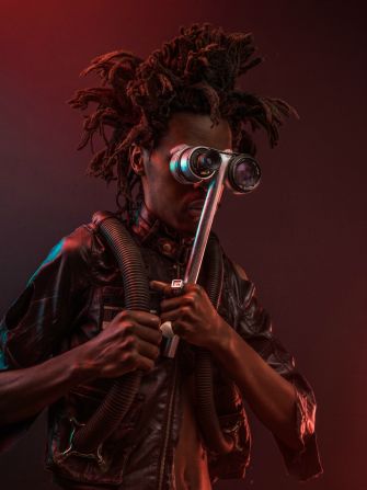 Karanja 'the mole' jere: normally operates underground with his modified underground breathing suite. His hair is designed to appear like a rodent burrowing through the soil and he's spectacles are telescopic able to see close to one kilometer away.