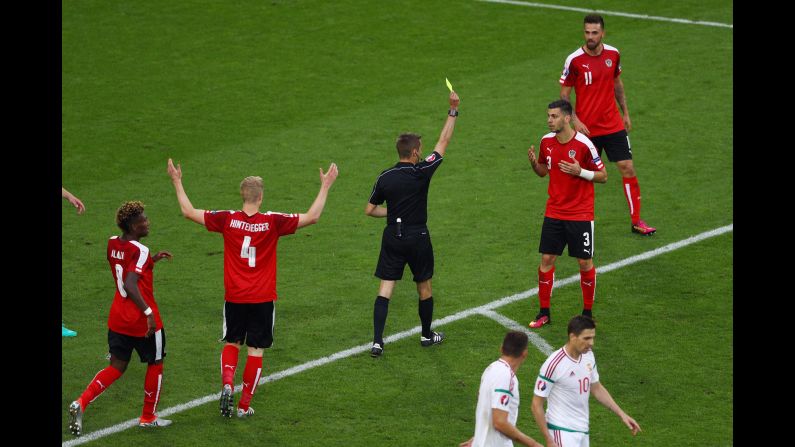 Austria defender Aleksandar Dragovic receives his second yellow card in the 66th minute. Austria played with 10 men for the rest of the match.