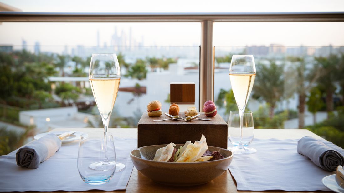 With pristine wooden floors, retro photos and a glass-fronted kitchen, the decor of Social by Heinz Beck is classic luxury with a modern twist. Its terrace offers a view over the grounds of the Waldorf Astoria Dubai Palm Jumeirah.