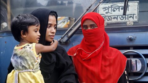 Sanjida Begum (in black veil) waits in front of Dhaka Magistracy to find out where her husband is, after he was detained by city police in Dhaka on Tuesday.