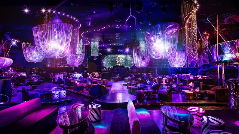 Chandeliers made of Swarovski crystals hang from the ceiling of the purple Cavalli Club Dubai. This is a party destination, but one that still offers a solid four-course Italian dinner. 