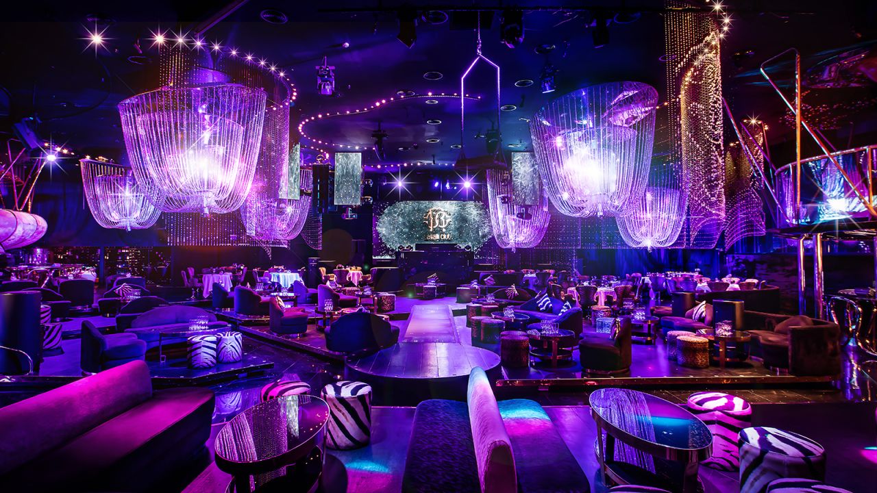 Chandeliers made of Swarovski crystals hang from the ceiling of the purple Cavalli Club Dubai. This is a party destination, but one that still offers a solid four-course Italian dinner. 