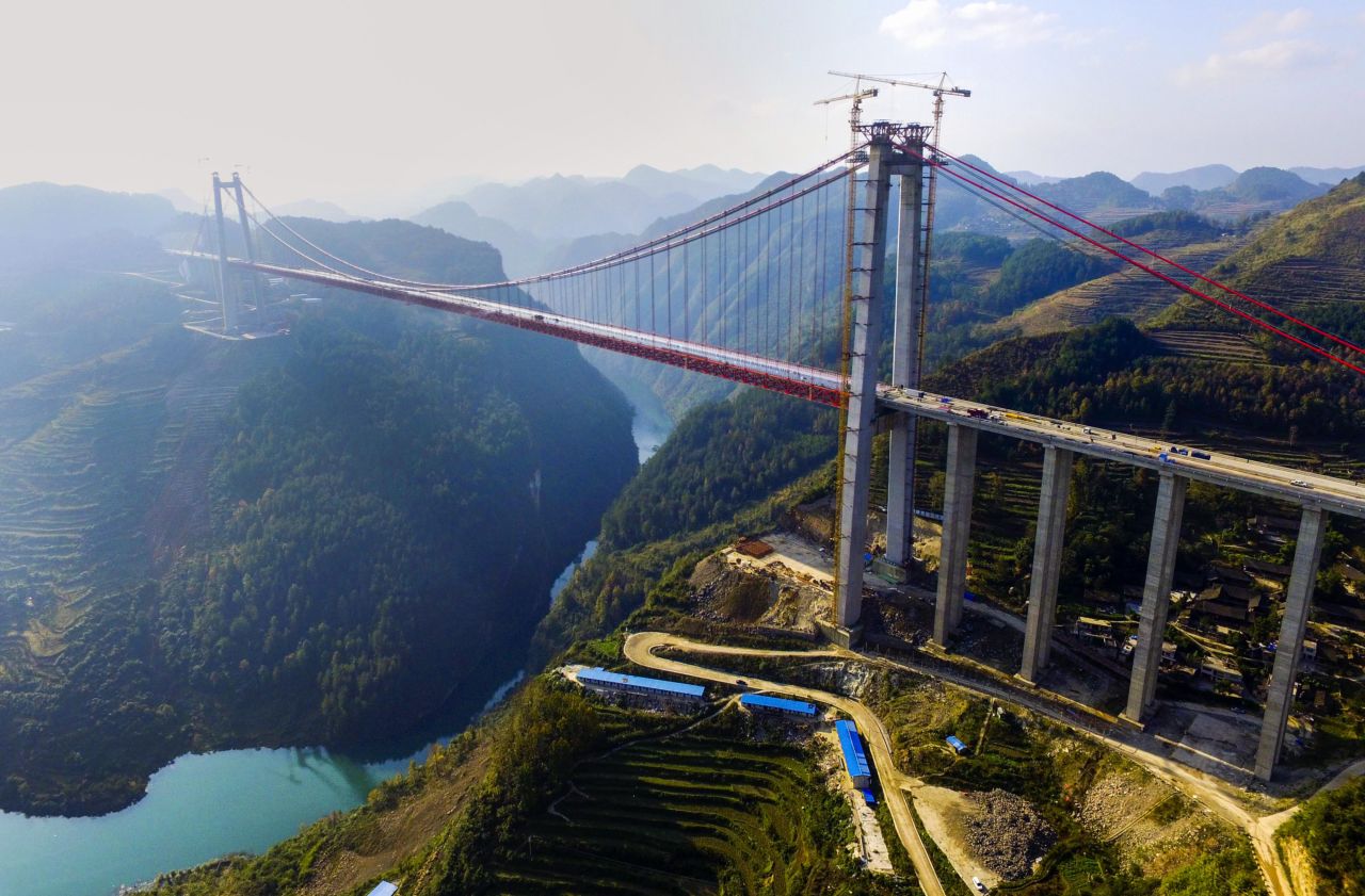 This huge suspension bridge, which crosses the Qingshui River in Wengan county, southwest Guizhou, is one of the world's highest bridges. Built in rocky karst terrain, the 2,171-meter-long structure opened last year and improves transport links between the provincial capital Guiyang and Yunnan to the southwest. 