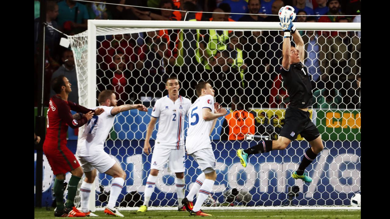 Iceland goalkeeper Hannes Thor Halldorsson makes a save during the draw with Portugal.