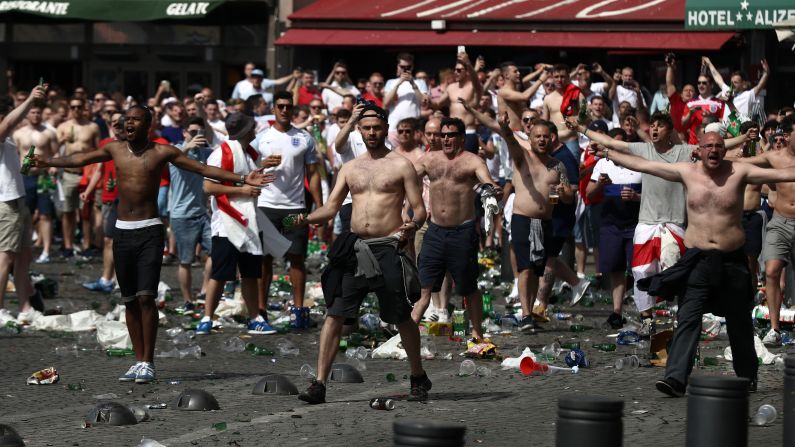 England fans, seen here, clash with Russian fans before their match in Marseille on Saturday. UEFA's executive committee has warned both England and Russia that their teams could face further sanctions -- including potential disqualification from the tournament -- if their fans are involved in more violence.