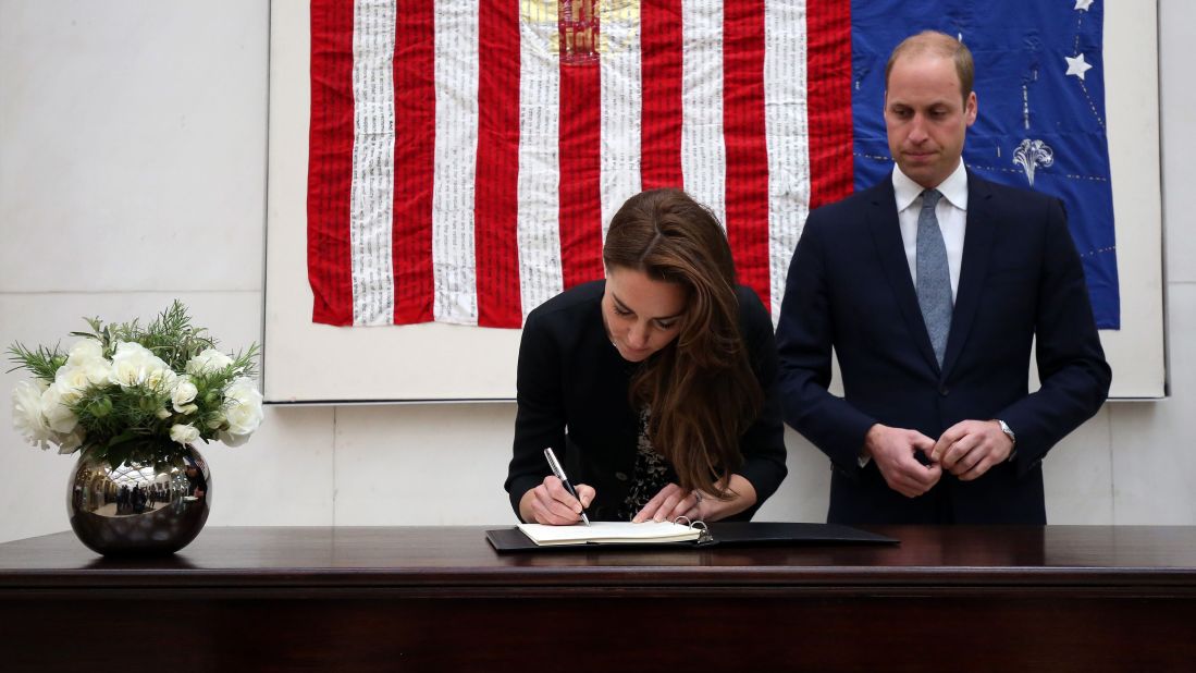 Britain's Prince William and his wife, Catherine, sign a book of condolences at the U.S. Embassy in London on June 14.