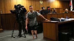 Paralympic athlete Oscar Pistorius walks in the courtroom without his prosthetic legs during his resentencing hearing for the 2013 murder of his girlfriend Reeva Steenkamp at the Pretoria High Court on June 15, 2016.
A sobbing Oscar Pistorius walked hesitantly on his stumps around court on June 15 in a dramatic demonstration of his disability ahead of his sentencing for murdering his girlfriend Reeva Steenkamp. / AFP PHOTO / POOL / Alon SkuyALON SKUY/AFP/Getty Images