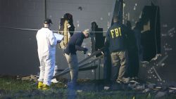 FBI agents investigate near the damaged rear wall of the Pulse Nightclub where Omar Mateen allegedly killed at least 50 people on June 12, 2016 in Orlando, Florida. The mass shooting killed at least 50 people and injuring 53 others in what is the deadliest mass shooting in the country's history.